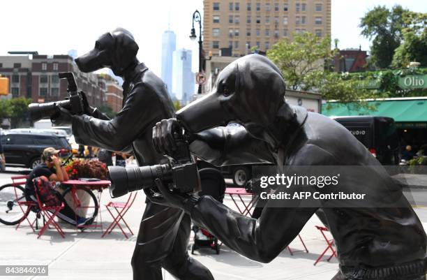 Sculpture called the " Paparazzi Dogs" created by Australian husband and wife team of Gillie and Marc on the corner at the intersection of Greenwich...