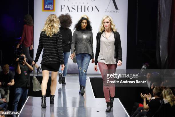 Models walk the runway at the ALDI SUED x Anastacia collection launch 'Music loves Fashion' at E-Werk on September 7, 2017 in Cologne, Germany.