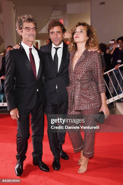 Silvio Soldini, Adriano Giannini and Valeria Golino walk the red carpet ahead of the 'Emma ' screening during the 74th Venice Film Festival at Sala...