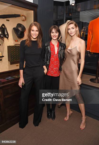 Charlotte Wiggins, Sam Rollinson and Eve Delf attend the launch of the 'Kingsman' shop on St James's Street in partnership with MR PORTER, MARV &...