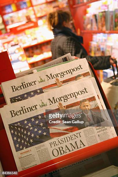 Newly-appointed U.S. President Barack Obama dominates the covers of German newspapers at a kiosk the day after his inauguration on January 21, 2009...