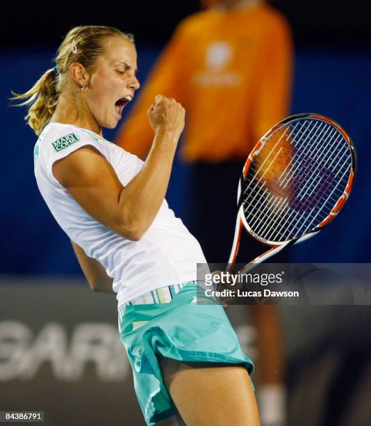 Jelena Dokic of Australia celebrates winning the first set in her second round match against Anna Chakvetadze of Russia during day three of the 2009...