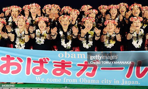 Housewives of amateur hula dancers group "Obama Girls" shout "Yes we can!" during a rally to support US Democratic presidential hopeful Sen. Barack...