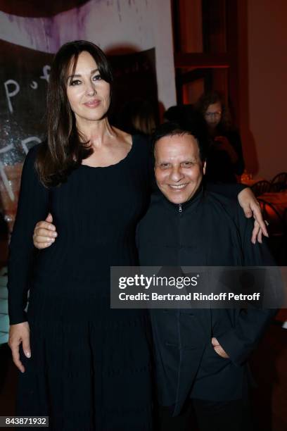 Actress Monica Bellucci, dressed in Azzedine Alaia, and stylist Azzedine Alaia attend the "Richard Wentworth a la Maison Alaia" Exhibition Opening at...