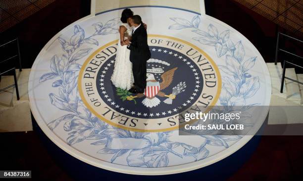 President Barack Obama and First Lady Michelle Obama dance during the Commander-in-Chief Ball at the National Building Museum in Washington, DC,...