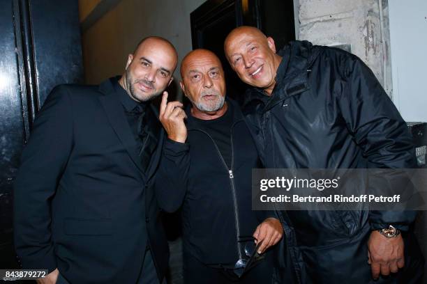 Jean-Baptiste Mondino standing between Security Men attend the "Richard Wentworth a la Maison Alaia" Exhibition Opening at Azzedine Alaia Gallery on...