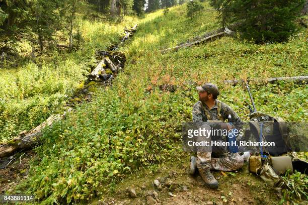 Hunter Gabe Kettle, from Fruita, takes a break by a stream on his way towards Capitol Lake along the Upper Capitol Creek Trail on September 6, 2017...