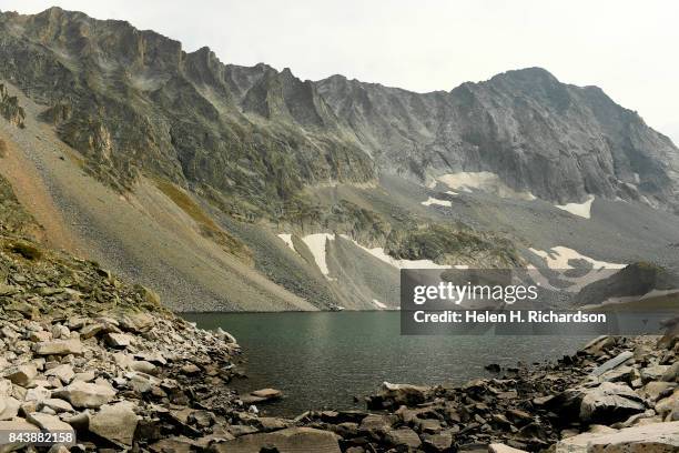 Capitol Peak can be seen from Capitol Lake on September 6, 2017 in the Maroon Bells-Snowmass Wilderness, Colorado. Capitol Peak is one of Colorado's...