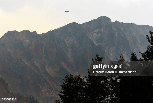 National Guard Black Hawk helicopter searches for a stranded climber near the K2 summit on Capitol Peak on September 6, 2017 in the Maroon...