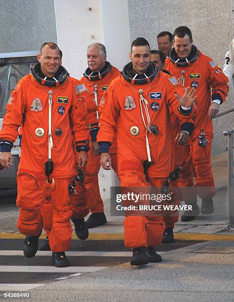 The US space Shuttle Discovery's crew on January 21, 2009 as they leave the crew quarters at Kennedy Space Center in Florida for a ride to launch pad...