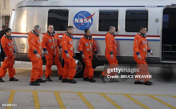 The US space Shuttle Discovery's crew on January 21, 2009 as they leave the crew quarters at Kennedy Space Center in Florida for a ride to launch pad...