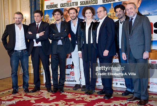 Director Giovanni Veronesi and producer Aurelio De Laurentiis pose with cast of the movie "Italians" at St Regis Grand Hotel on January 21, 2009 in...