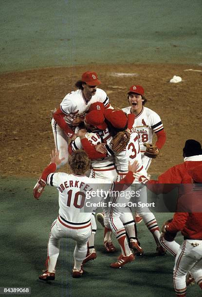 St Louis Cardinals players are all over each other in front of the mound with jubilation after the Cardinal defeat the Milwaukee Brewers in game...