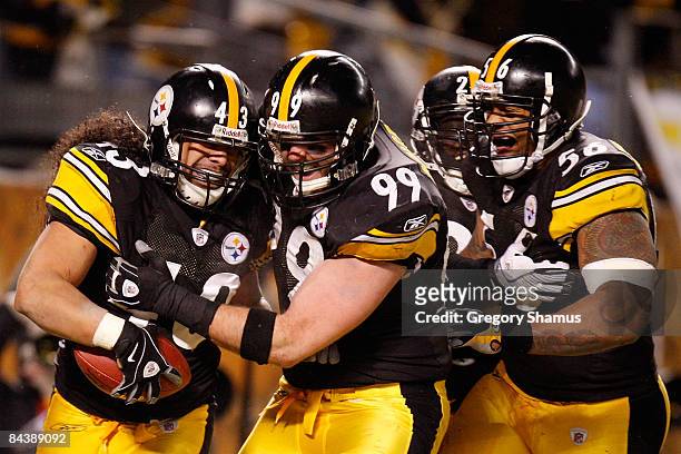 Safety Troy Polamalu of the Pittsburgh Steelers celebrates his touchdown with defensive end Brett Keisel, safety Tyrone Carter and linebacker LaMarr...