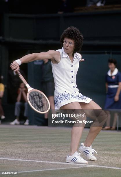 Billie Jean King of the USA hits a backhand return against Evonne Cawley during championship play of the women's singles at the Wimbledon Lawn Tennis...