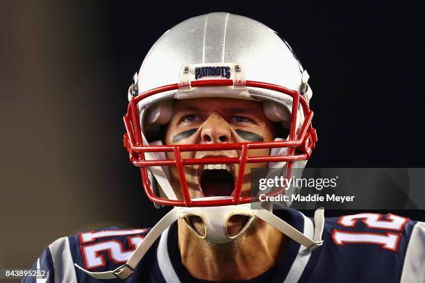 Tom Brady of the New England Patriots yells as he runs onto the field before the game against the Kansas City Chiefs at Gillette Stadium on September...