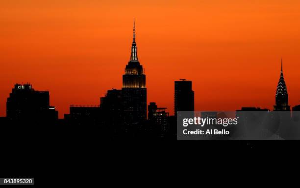 The sun sets over the Manhattan skyline as seen from Arthur Ashe Stadium on Day Eleven of the 2017 US Open at the USTA Billie Jean King National...