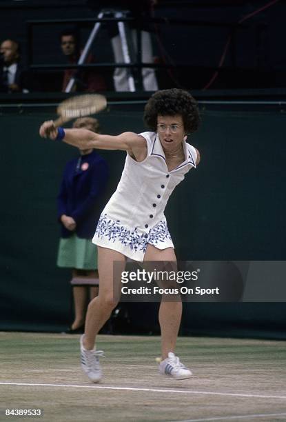Billie Jean King of the USA hits a backhand return against Evonne Cawley during championship play of the women's singles at the Wimbledon Lawn Tennis...