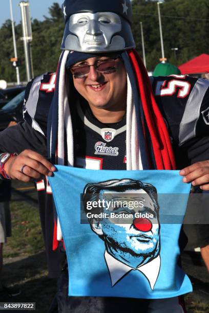 Chris O'Neil of Boston holds a towel mocking NFL Commissioner Roger Goodell before the start of the game. The New England Patriots host the Kansas...