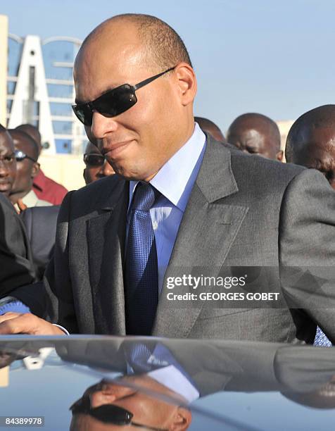 Photo taken on October 30, 2008 shows the son of Senegalese President Abdoulaye Wade, Karim Wade, taking part in a ceremony marking the renovation of...