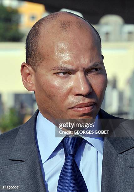 Photo taken on October 30, 2008 shows the son of Senegalese President Abdoulaye Wade, Karim Wade, taking part in a ceremony marking the renovation of...