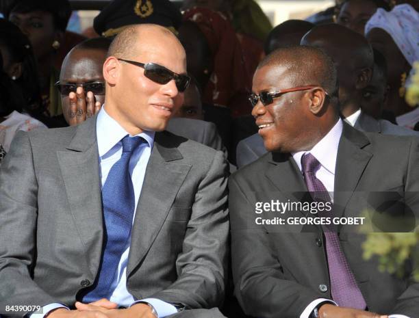 Photo taken on October 30, 2008 shows the son of Senegalese President Abdoulaye Wade, Karim Wade , speaking with the general-secretary of the...