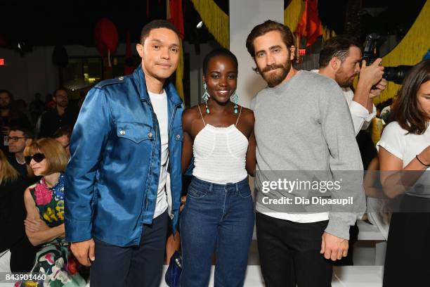 Host Trevor Noah and actors Lupita Nyong'o and Jake Gyllenhaal attend the Calvin Klein Collection fashion show during New York Fashion Week on...
