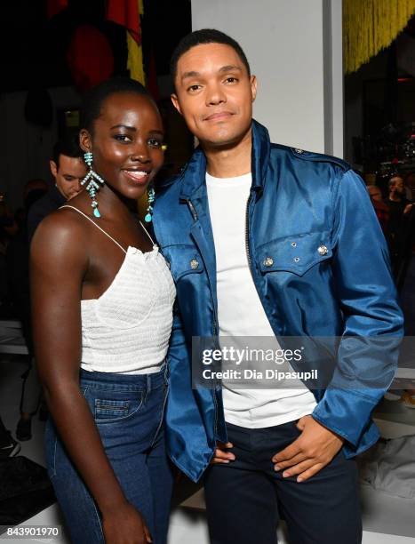 Actress Lupita Nyong'o and TV host Trevor Noah attend the Calvin Klein Collection fashion show during New York Fashion Week on September 7, 2017 in...