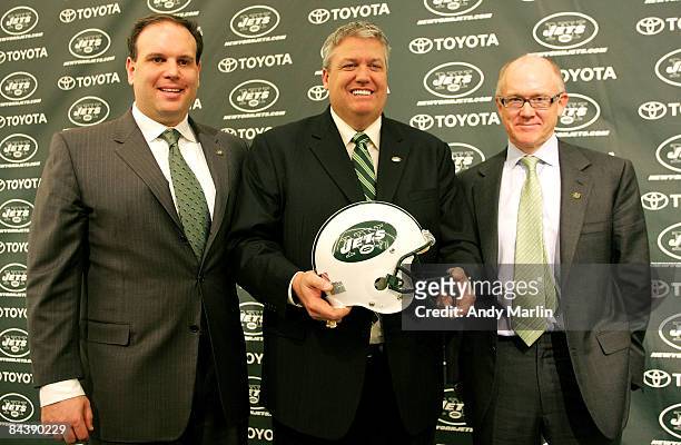 New York Jets Head Coach Rex Ryan Owner Woody Johnson and General Manager Mike Tannenbaum pose for a photo at a press conference naming Ryan as the...