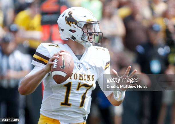Quarterback Josh Allen of the Wyoming Cowboys looks for a receiver in the third quarter against the Iowa Hawkeyes, on September 2, 2017 at Kinnick...