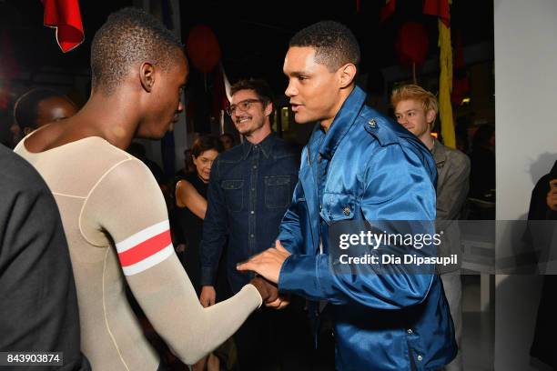 Actor Pedro Pascal and TV host Trevor Noah attend the Calvin Klein Collection fashion show during New York Fashion Week on September 7, 2017 in New...