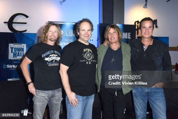 Eric Kretz, Eddie Trunk, Dean DeLeo and Robert DeLeo attend SiriusXM's Town Hall with Stone Temple Pilots at The Gibson Showroom in Los Angeles on...