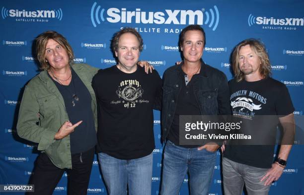 Dean DeLeo, Eddie Trunk, Robert DeLeo and Eric Kretz attend SiriusXM's Town Hall with Stone Temple Pilots at The Gibson Showroom in Los Angeles on...