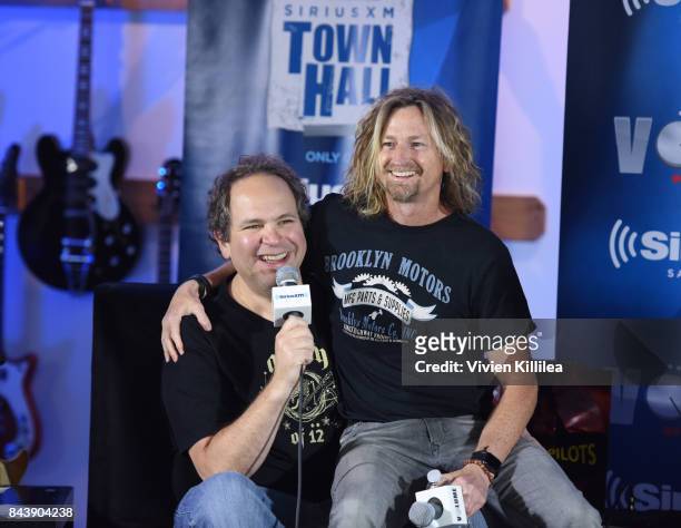 Eddie Trunk and Eric Kretz speak at SiriusXM's Town Hall with Stone Temple Pilots at The Gibson Showroom in Los Angeles on September 7, 2017 in Los...