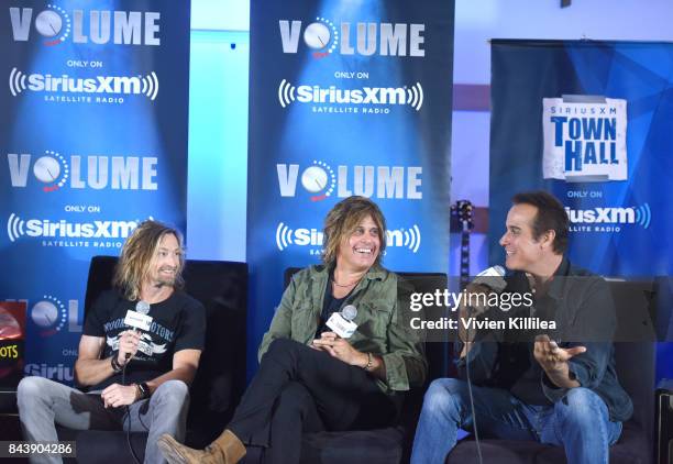 Eric Kretz, Dean DeLeo and Robert DeLeo speak at SiriusXM's Town Hall with Stone Temple Pilots at The Gibson Showroom in Los Angeles on September 7,...