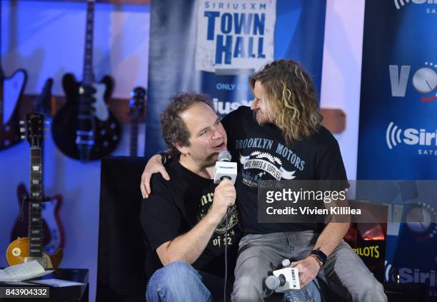 Eddie Trunk and Eric Kretz speak at SiriusXM's Town Hall with Stone Temple Pilots at The Gibson Showroom in Los Angeles on September 7, 2017 in Los...