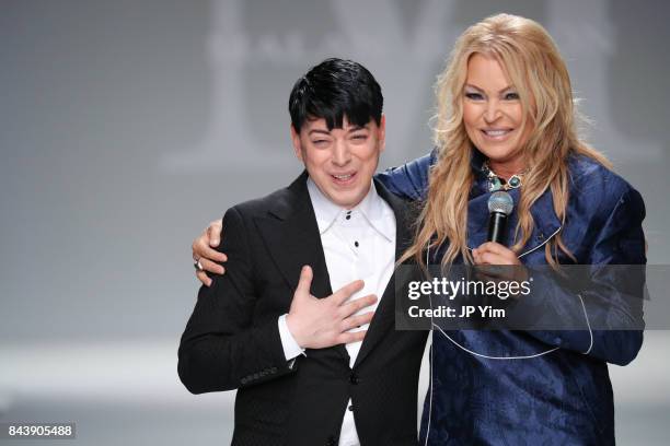 Designer Malan Breton and singer Kristine W walk the runway at the Malan Breton SS2018 Collection during New York Fashion Week at Intrepid on...