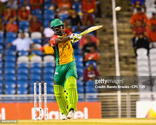 In this handout image provided by CPL T20, Chadwick Walton of Guyana Amazon Warriors hits 6 during Eliminator 2 of the 2017 Hero Caribbean Premier...