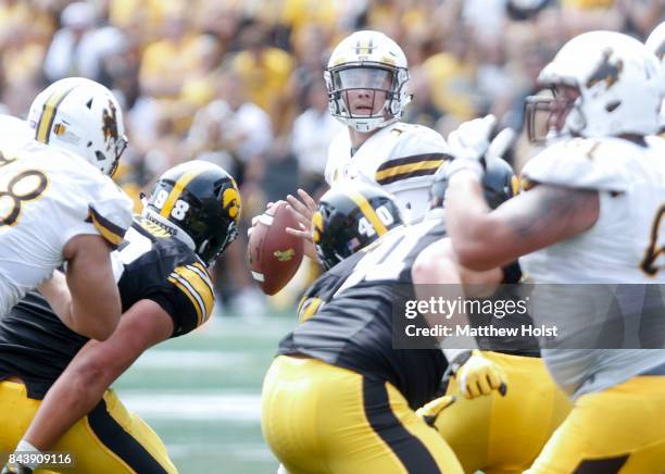 Quarterback Josh Allen of the Wyoming Cowboys looks for a receiver in the fourth quarter against the Iowa Hawkeyes, on September 2, 2017 at Kinnick...