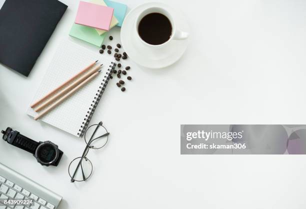 top view office working desk with notepad and tablet ,keyboard and sunglasses relaxing drink with coffee cup and roasted coffee seed - coffee drink on white stock pictures, royalty-free photos & images