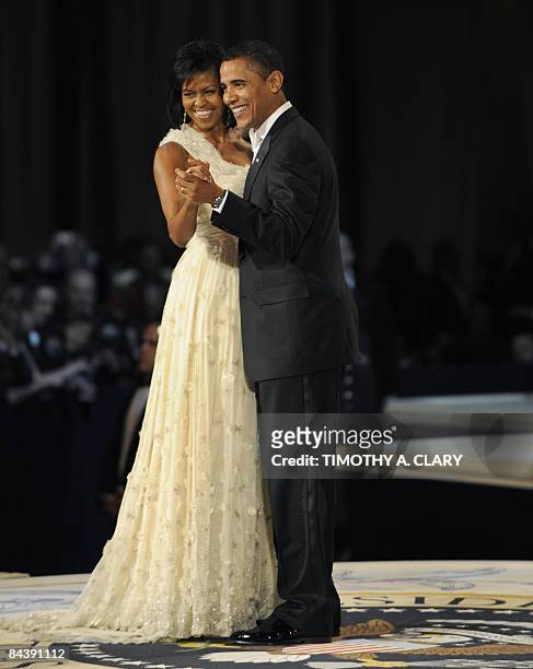 President Barack Obama and his wife Michelle dance during the Commander in Chief's Ball at the National Building Museum in Washington January 20,...