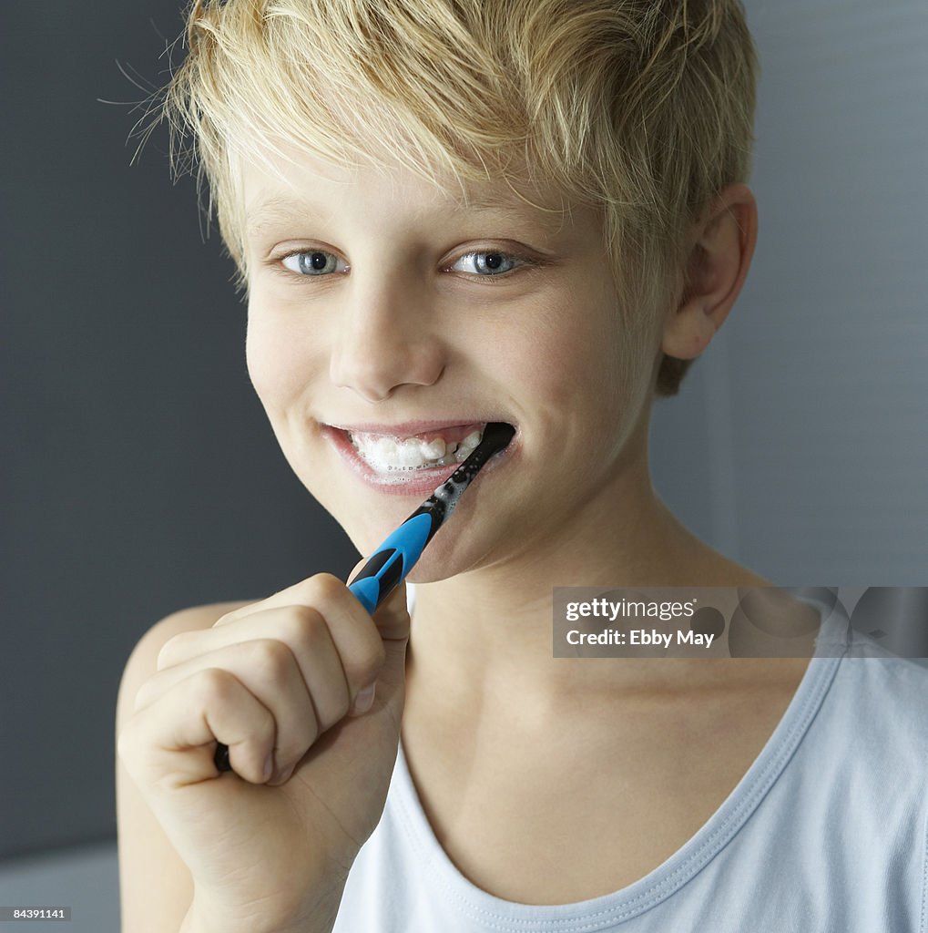Boy brushing his teeth
