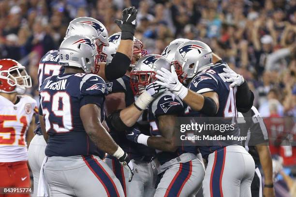 Mike Gillislee of the New England Patriots celebrates with teammates after scoring a touchdown during the second quarter against the Kansas City...