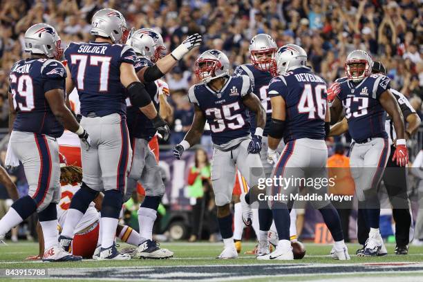 Mike Gillislee of the New England Patriots celebrates with teammates after scoring a touchdown during the second quarter against the Kansas City...