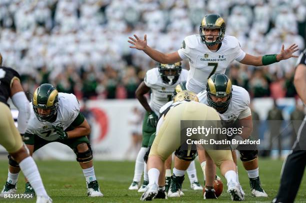 Quarterback Nick Stevens of the Colorado State Rams runs the offense against the Colorado Buffaloes at Sports Authority Field at Mile High on...