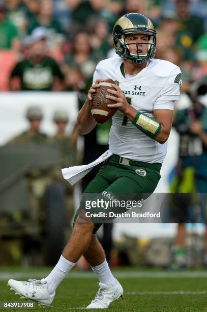 Quarterback Nick Stevens of the Colorado State Rams passes against the Colorado Buffaloes in the first half of a game at Sports Authority Field at...