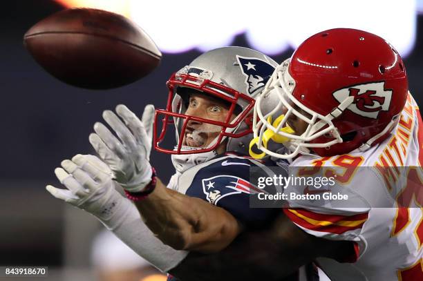 New England Patriots wide receiver Chris Hogan fails to make a reception defended by Kansas City's Terrance Mitchell during the second quarter. The...