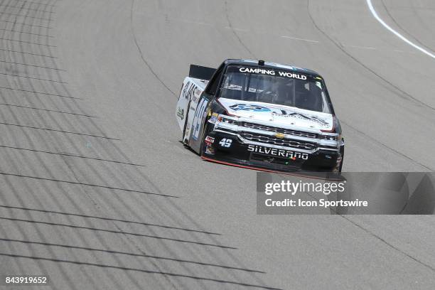 Wendell Chavous , driver of the JAS Expedited Trucking, LLC Chevrolet, races during the Camping World Truck Series LTi Printing 200 race on August...