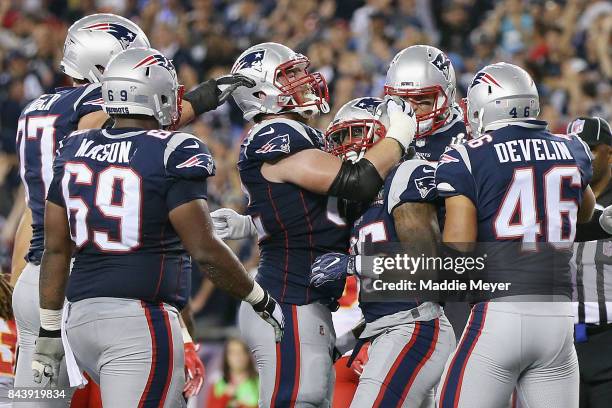 Mike Gillislee of the New England Patriots celebrates with teammates after scoring a touchdown during the second quarter against the Kansas City...