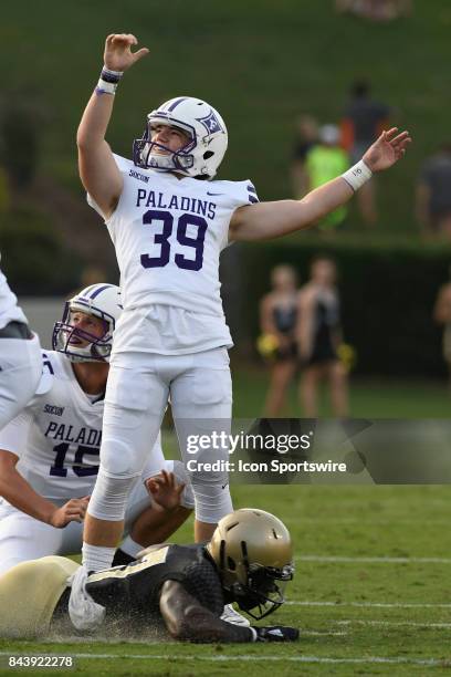 Grayson Atkins place kicker/punter Furman University Paladins tries to will a missed field goal inside the uprights in a Southern Conference rivalry...